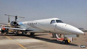 A Legacy 650 Embraer aircraft stands on the tarmac at the India Aviation 2012 show at Begumpet Airport in Hyderabad on March 2012