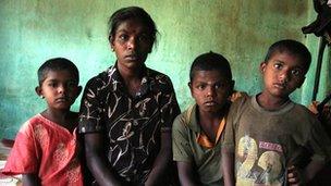 Tea plantation worker and her family