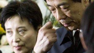 Chongqing Communist Party Secretary Bo Xilai, right, accompanied by his wife Gu Kailai