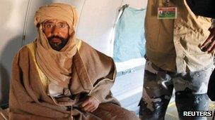 Saif al-Islam Gaddafi sitting in a plane in Zintan after his capture (November 19, 2011)