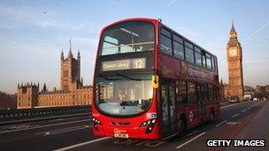 A London bus going over Westminster Bridge