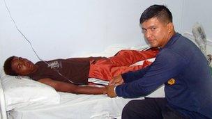 Adrian Vasquez receives medical attention aboard an Ecuadorean navy ship offshore Galapagos Islands, 25 March 2012