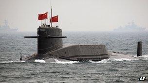 In this April 23, 2009 file photo, a Chinese Navy nuclear-powered submarine sails during an international fleet review in the waters off Qingdao, China