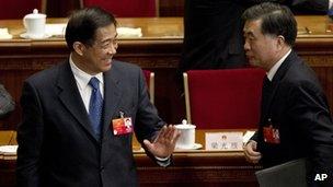 Bo Xilai, left, gestures next to Wang Yang, Guangdong party secretary, 11 March 2012