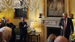 David Cameron laughs as London Mayor Boris Johnson delivers a speech at a reception for UK mayors