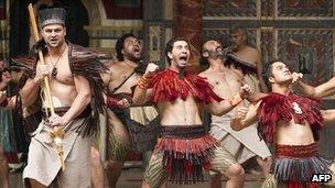 Members of New Zealand's Ngakau Toa theatre company perform a haka on stage at the Globe theatre