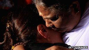 Sri Mata Amritanandamayi Dev, the hugging saint known as "Amma" (mother) hugs a visitor on the first day of her Australia tour on April 12, 2012 in Melbourne, Australia