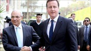 Ahmed Shafiq shaking hands with British Prime Minister, David Cameron