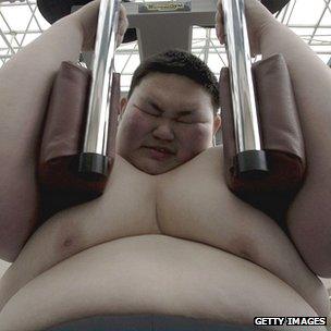 Obese boy doing exercise