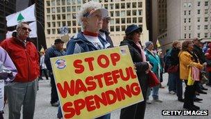 Tea Party members rally to protest President Barack Obama's proposed "Buffett rule" tax plan on April 16, 2012 in Chicago, Illinois