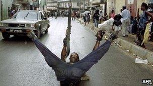 A file photo taken on 31 May 1997 shows a Sierra Leonean soldier of the Revolutionary United Front (RUF) posing in a street of Freetown