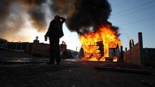 Burning caravan, used as a barricade by travellers during the Dale Farm evictions