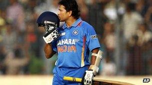 Sachin Tendulkar kisses his helmet after scoring his 100th century - 16 March 2012