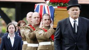 The coffin of Sgt Nigel Coupe is brought to St Annes Parish Church