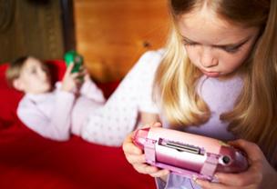 Girls playing electronic games