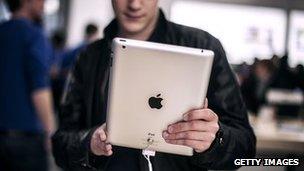 A man holds the latest Apple iPad