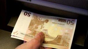 Euro notes at an ATM