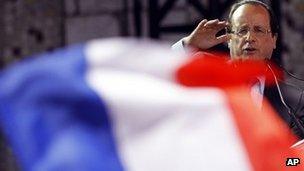 A French flag flutters as Francois Hollande makes an election visit to Nice, southern France, 28 March