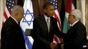 Benjamin Netanyahu watches as President Barack Obama shakes hands with Palestinian President Mahmoud Abbas (2009)