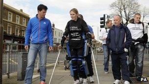 Tim Henman walking with Claire Lomas