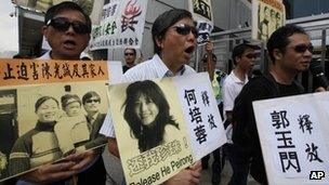 Activists outside the China's Liaison Office in Hong Kong 30 April, 2012