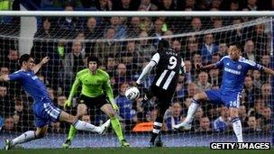 Papiss Cisse of Newcastle scores against Chelsea