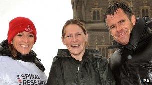 Claire Lomas (middle) with Gabby and Kenny Logan on Tower Bridge, London