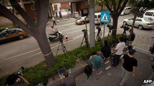 Foreign media gathered in a police cordon outside the hospital where blind Chinese activist Chen Guangcheng is receiving treatment in Beijing on 7 May, 2012