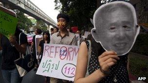 Thai activists stage a march against the country's widely-criticised laws protecting the monarchy, in Bangkok on 10 December, 2011