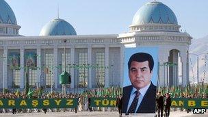 Participants of a parade carry a portrait of their President Saparmurat Niyazov as they celebrate the Turkmenistan's Independence Day in Ashgabat, 27 October 2005.