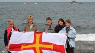 The Guernsey flag at Cobo Bay