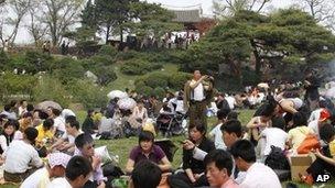 North Koreans picnic in front of Ulmil Pavilion on Moran Hill, in Pyongyang, North Korea, on 1 May, 2012