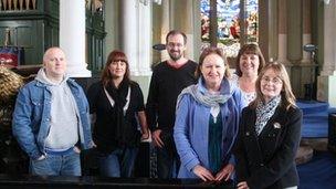 Project workers inside the Holy Trinity Church