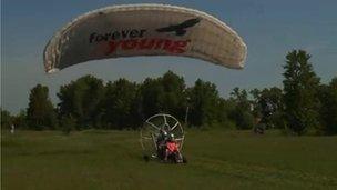 A paratrike taking off