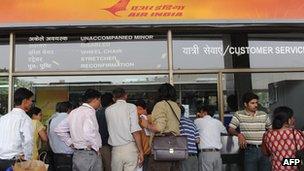 Customers at an Air India counter