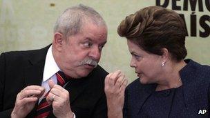 Brazil's President Dilma Roussef (right) talks to her predecessor Luiz Inacio Lula da Silva during the inauguration of the truth commission