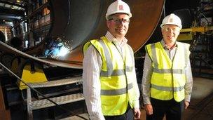 David Steele (left) from Wind Towers and Graham Brown from Burcote Wind in front of a wind tower section in Machrihanish, Kintyre