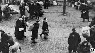 Jews are gathered at an assembly point in the Kaunas ghetto for deportation.