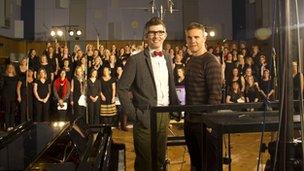 Gary Barlow with Gareth Malone (l) and the Military Wives choir