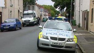 Police vehicles in a street