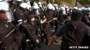 Riot police and protesters clash in Chicago