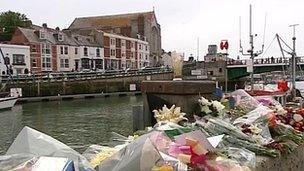 Floral tributes on Weymouth's quayside