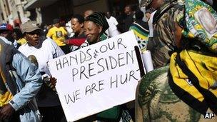 Supporters of South African President Jacob Zuma gather outside the South Gauteng High Court in Johannesburg, South Africa, Tuesday 22 May 2012