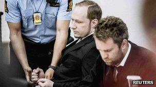 Anders Behring Breivik is relieved of his handcuffs in court in Oslo, 22 May