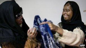 Acid attack survivors Naila Farhat and Naziran Bibi at the Al-Shifa trust eye hospital in Rawalpindi, Pakistan, in December 2009