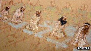 The five men accused of plotting the 9/11 attacks pray at their arraignment hearing Guantanamo Bay, Cuba 5 May 2012