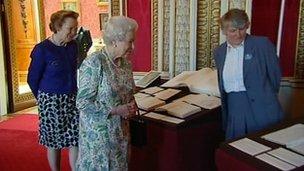 The Queen inspecting Queen Victoria's journals