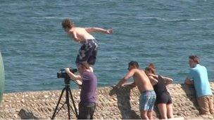 Boy about to jump into sea