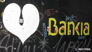 Bankia logo covered in grafitti