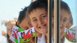 Children travel with the Olympic torch on the Ffestiniog Railway on its way to Porthmadog